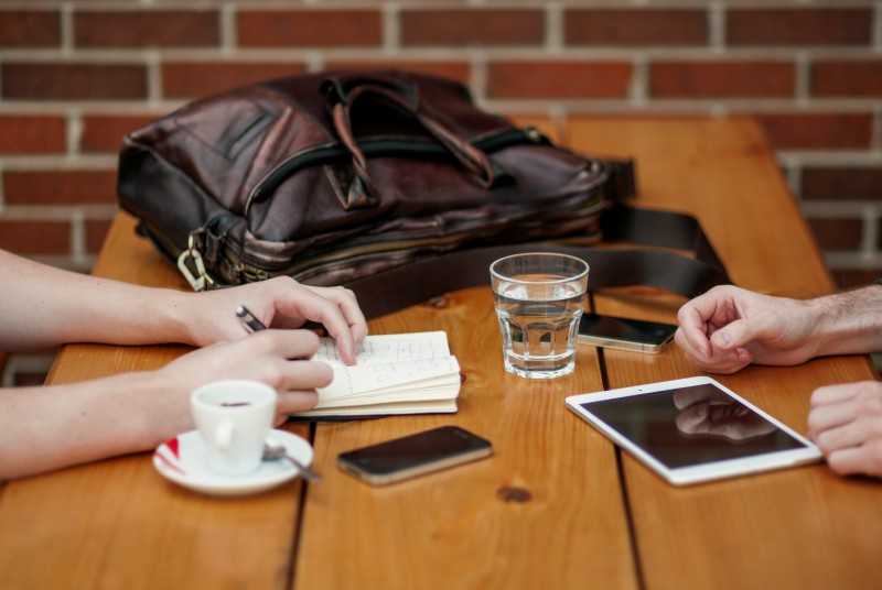 People sitting at cafe table